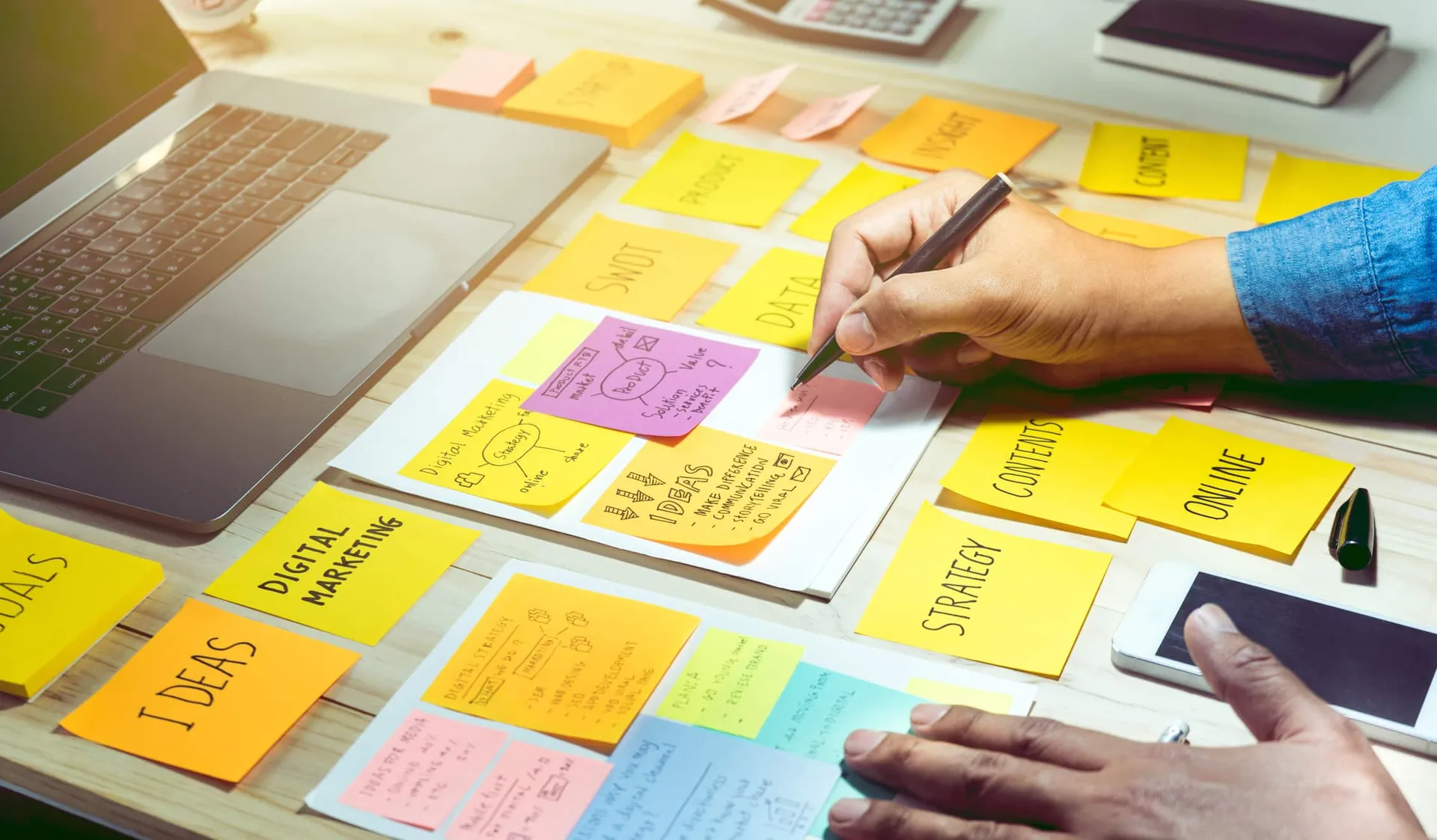 Notepaper with male hand.Business brainstorming and communication marketing plan concept