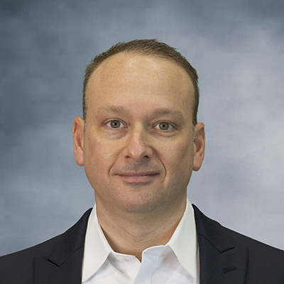 DanK_headshot_2025_gray background_400x400